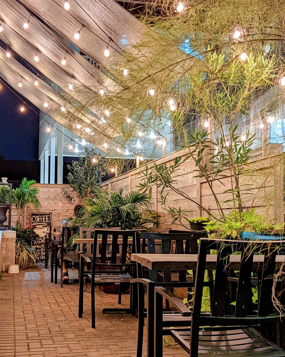 Courtyard patio with string lights at night