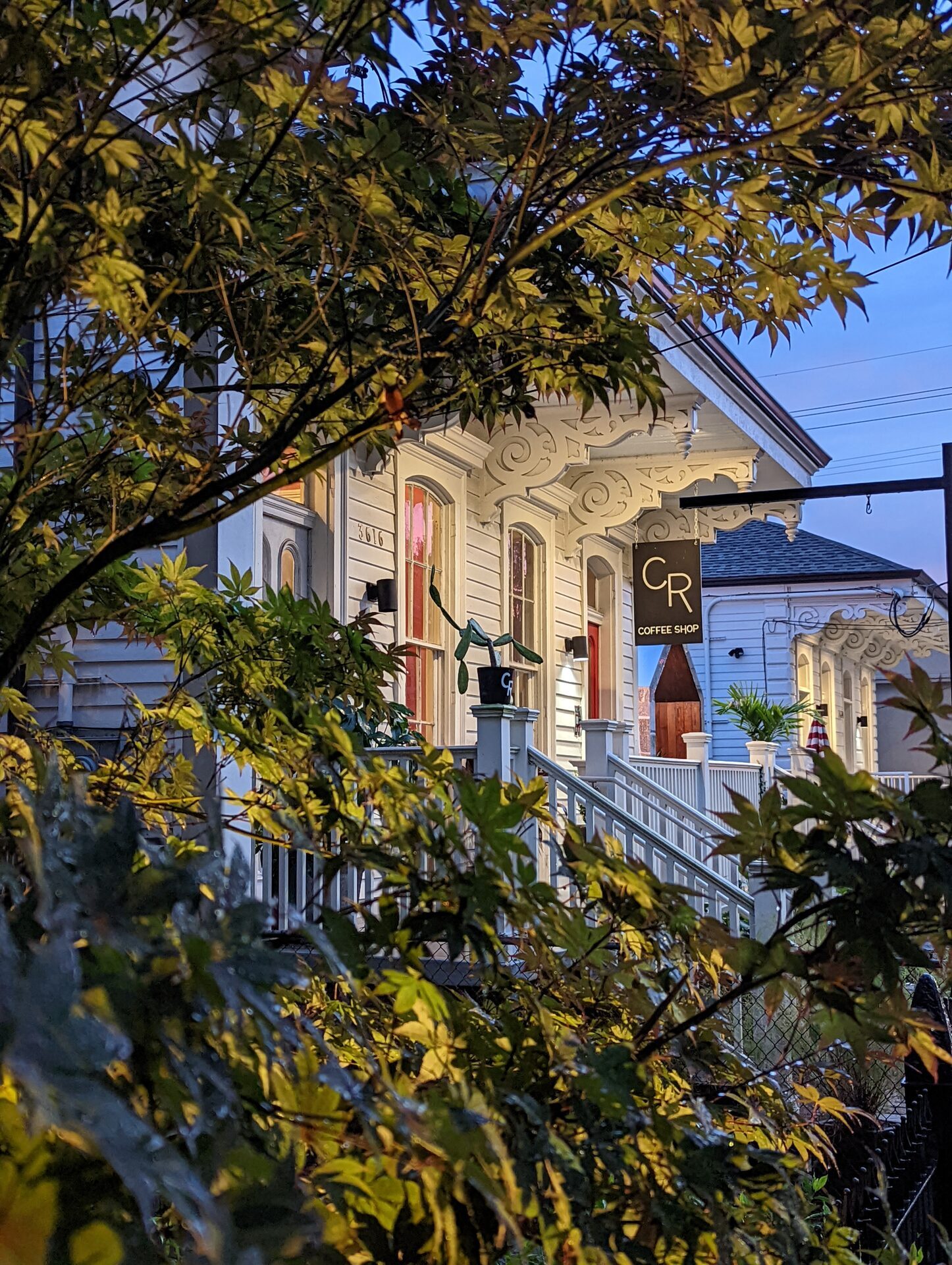 CR Coffee Magazine Street storefront at dusk